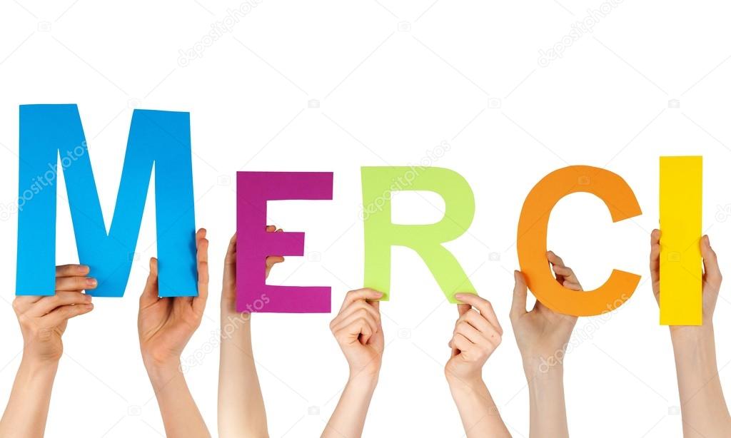 Hands holding the letters MERCI — Stock Photo © Nelosa 24939077