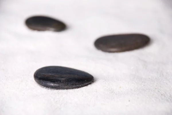 Three black stones — Stock Photo, Image