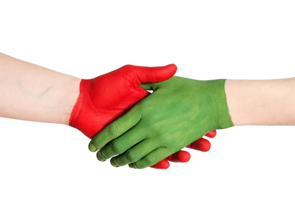 Kırmızı yeşil el sıkışma — Stok fotoğraf