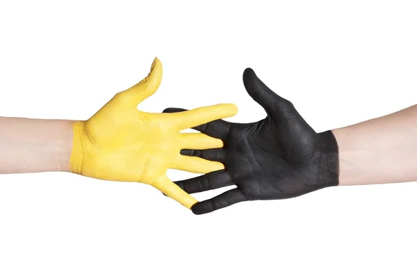 Preto e amarelo mão ajudando uns aos outros — Fotografia de Stock