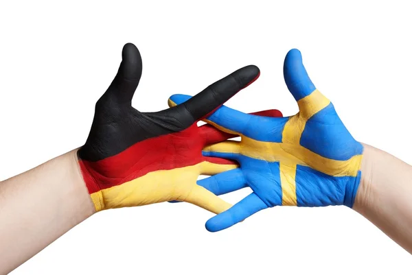 Eine schwedische und eine deutsch bemalte Hand — Stockfoto