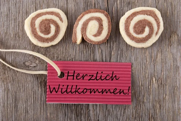 Herzlich Willkommen on a red label — Stock Photo, Image