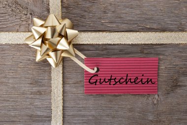 golden bow with red tag with Gutschein clipart