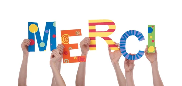 Muitas mãos segurando um Merci colorido — Fotografia de Stock