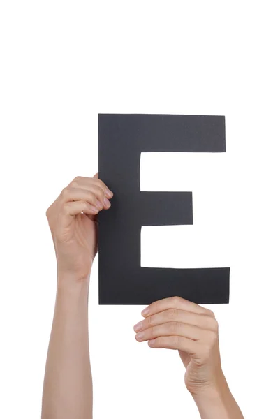 Manos que sostienen E — Foto de Stock