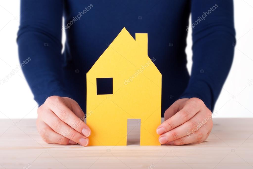 Hands Holding a House