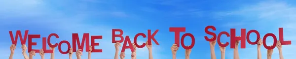 People Holding Welcome Back To School — Stock Photo, Image