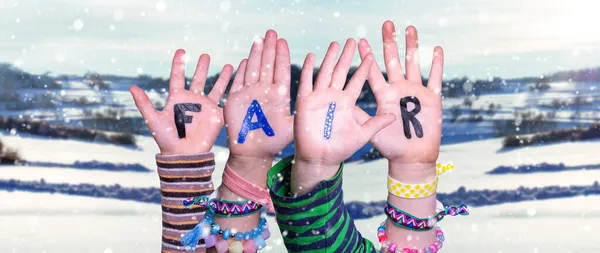 Barn händer bygga Word Fair, snöig vinter bakgrund — Stockfoto