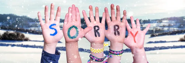 Children Hands Building Word Sorry, Snowy Winter Background — Stock Photo, Image