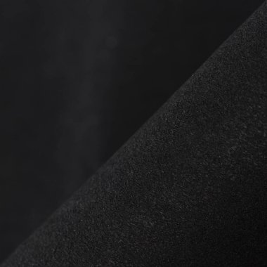 Siyah kumaş arka plan. Karanlık doğal madde. Tasarım için kopyalama alanı olan siyah dayanıklı kumaş dokusu arkaplanı.