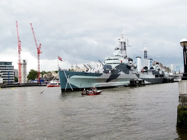 Battleship and Thames river Stock Image