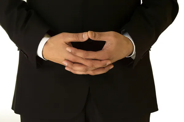 Empresário esperando com as mãos dobradas — Fotografia de Stock