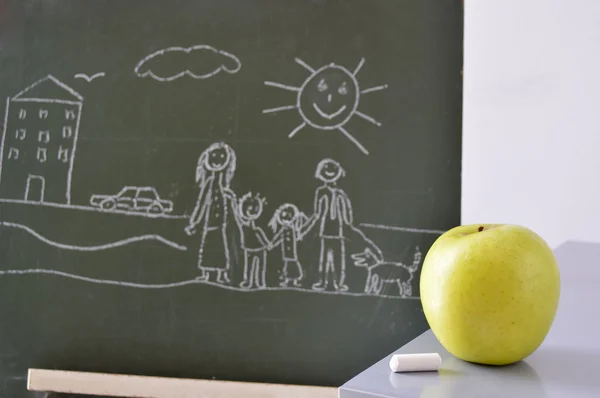 Blackboard with a drawing of a boy and an apple to eat — Stock Photo, Image