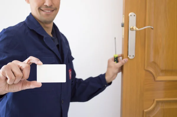 Carpenter shows your card with your number — Stock Photo, Image