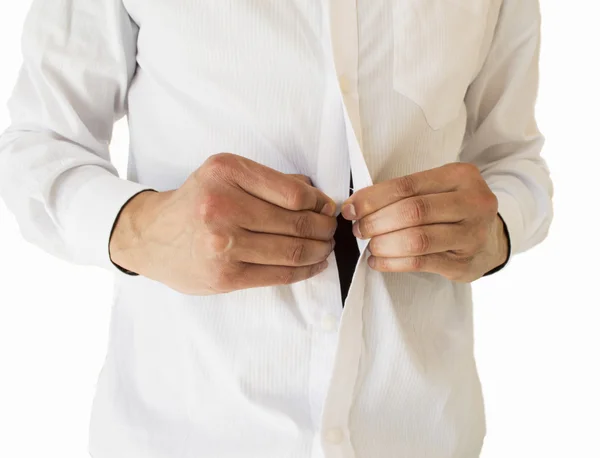 Detailoverzicht van zakenman haar shirt-knoppen aanpassen — Stockfoto