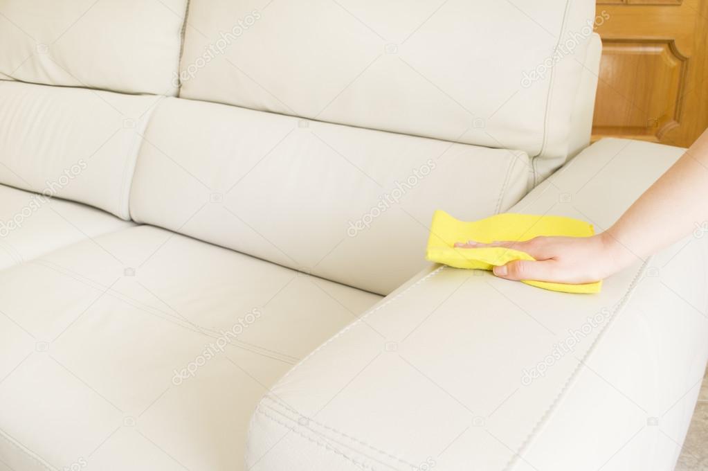 cleaning a beige sofa