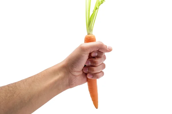 Χέρι του αρπάζει ένα καρότο με λευκό φόντο — Φωτογραφία Αρχείου