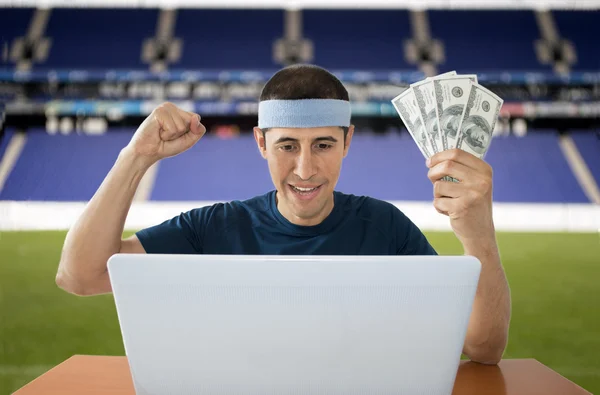Online betting dollar gaining in stadium — Stock Photo, Image