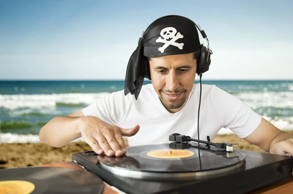 DJ mixing pirate on the beach — Stock Photo, Image