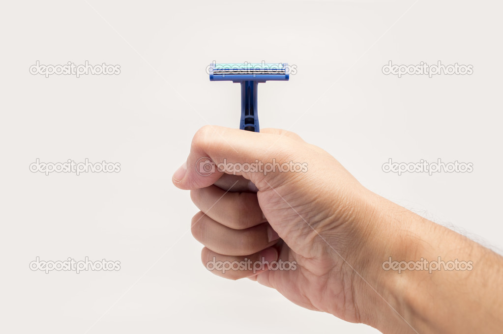 hand showing a safety razor