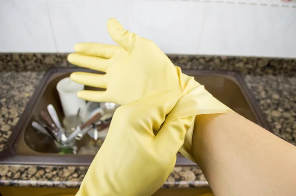 Close up a woman putting on the gloves — Stock Photo, Image