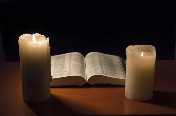 Bible with candlelight — Stock Photo, Image