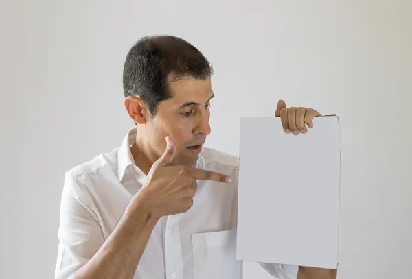 Pointing to the cover of a magazine — Stock Photo, Image