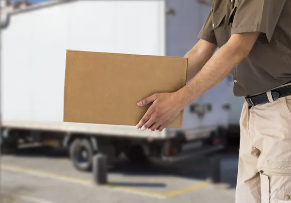 Handing out cardboard box — Stock Photo, Image