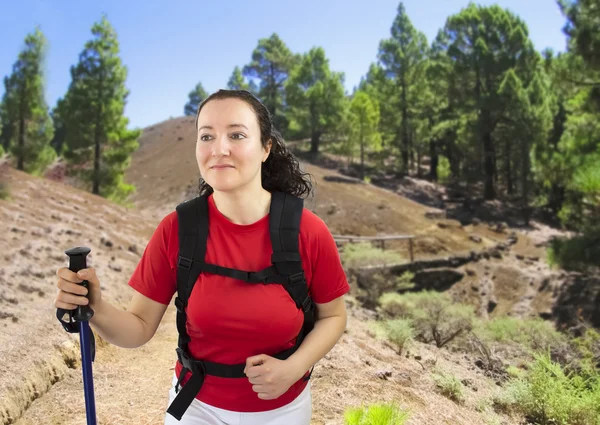 Woman with backpack on a trekking — Stock Photo, Image