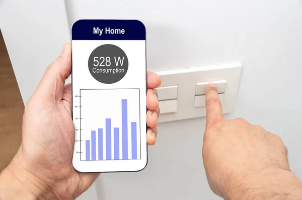 Close Man Hand Turning Light Phone Display Smart Electric Meter —  Fotos de Stock