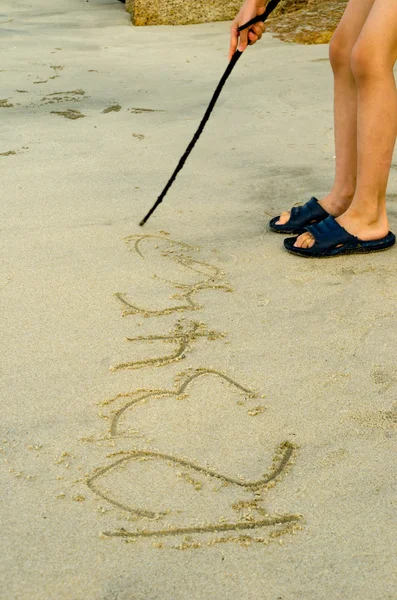 Schreiben auf Sand — Stockfoto