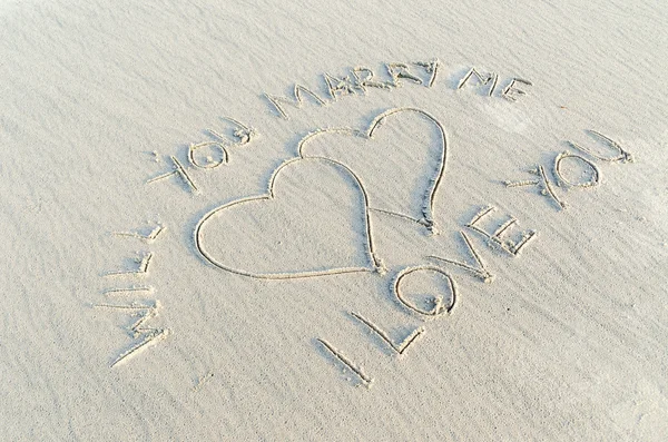 Love and text on sand — Stock Photo, Image