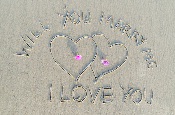 Love and text on sand