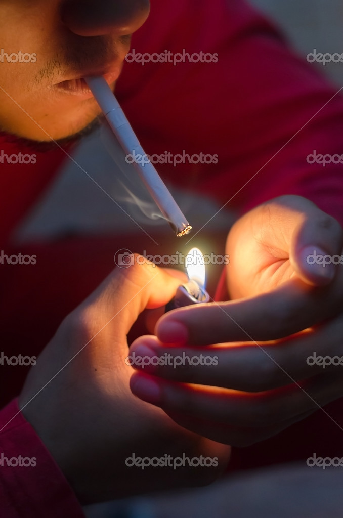 Lighting up cigarette Stock Photo by ©shahril 25116557