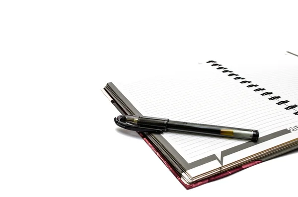 Pen op notebook — Stockfoto