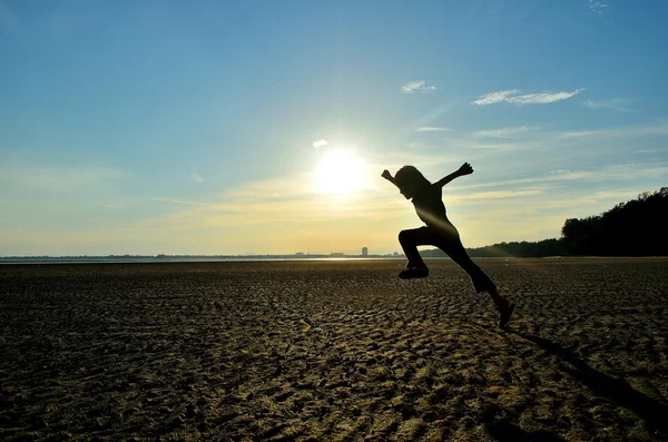 Silhouette of kid running — Stock Photo, Image