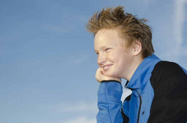 Portrait of youngster against blue sky — Stock Photo, Image