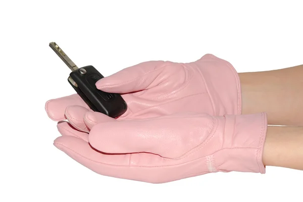Autoschlüssel in weiblichen Händen in rosa Handschuhen — Stockfoto