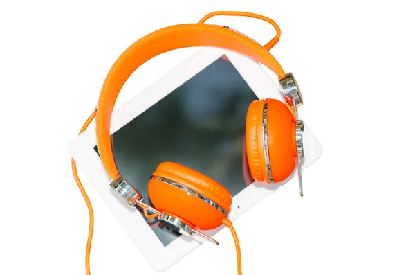 White tablet computer with orange headphones isolated on white — Stock Photo, Image