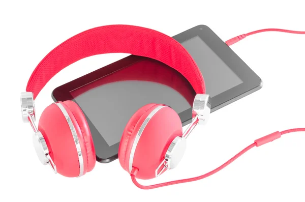 Bright red headphones and black tablet pc — Stock Photo, Image