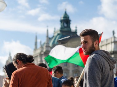 Face of a young activist on the background of the Palestinian fl clipart