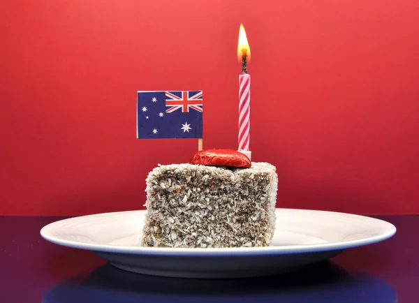 Australia Day Lamington Cake, flag and candle. — Stock Photo, Image
