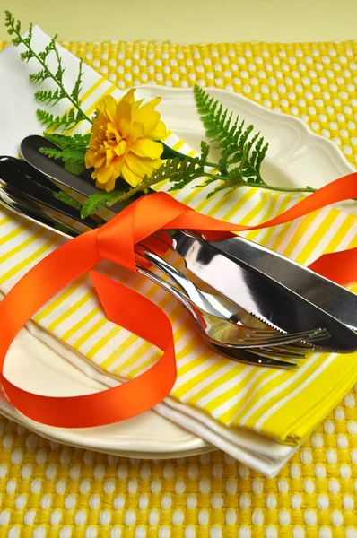 Yellow theme dining table setting with silver cutlery (vertical) — Stock Photo, Image