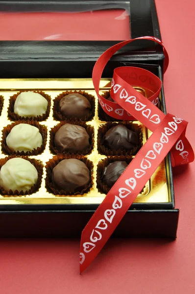 Valentine romantic opened box of chocolates. (vertical portrait) — Stock Photo, Image