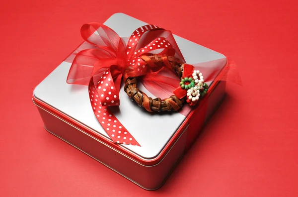 Festive Christmas present on red background. — Stock Photo, Image