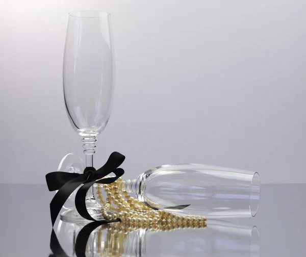 Champagne Glasses for black tie occasion celebration or New Years Eve party on white background. — Stock Photo, Image