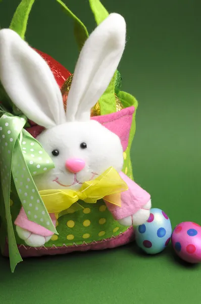 Easter Egg Hunt with bunny basket and colorful eggs - vertical — Stock Photo, Image