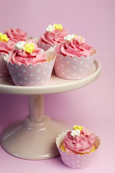 Beautiful pink cupcakes in star holders on pink cake stand for birthday, bridal, wedding, bachelorette or female special occasion event. — Stock Photo, Image