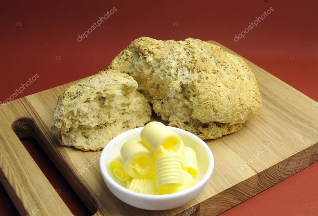 Australian traditional beer damper bread with butter curls Stock Photo ...