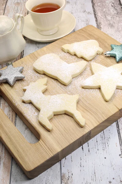 Christmas shapes shortbread cookies with cup of tea — Stock Photo, Image